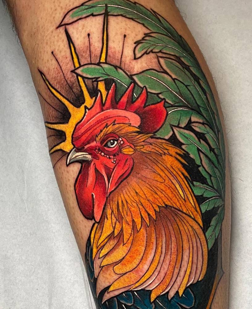 Neotraditional rooster tattoo on the calf.