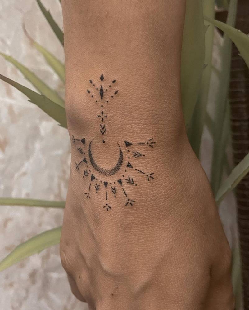 Ornamental tattoo on the wrist.