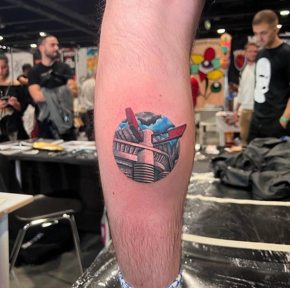 San Siro tattoo in illustrative style located on the calf.