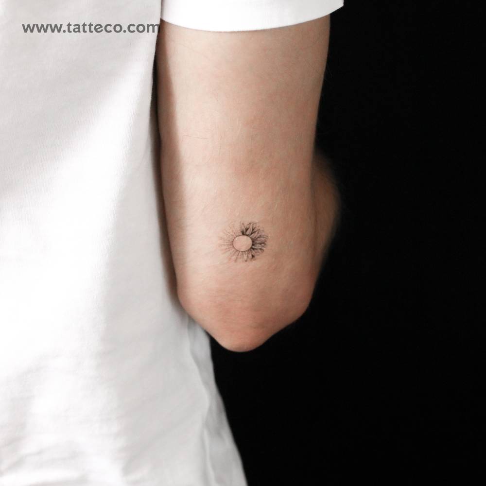 Sunflower sun semi-permanent tattoo located on the tricep.