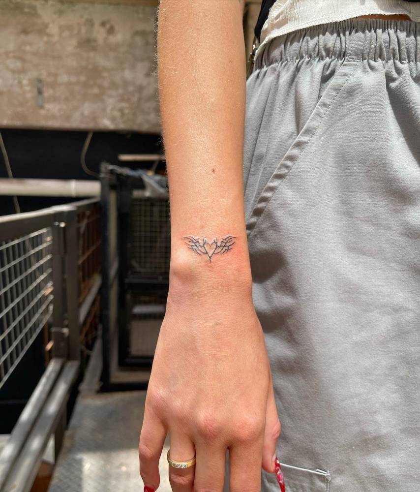 Devil heart tattooed on the wrist.