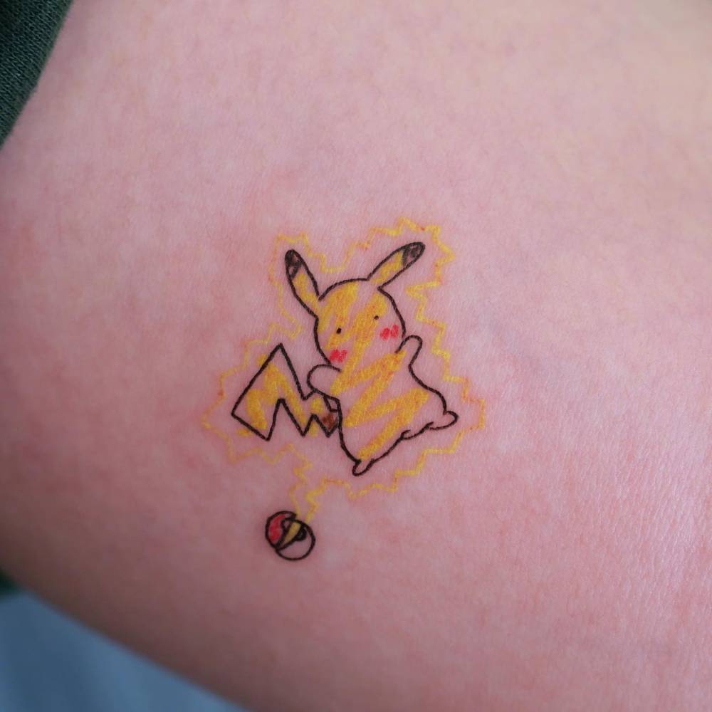 Cartoon style Pikachu tattoo done on the inner arm.