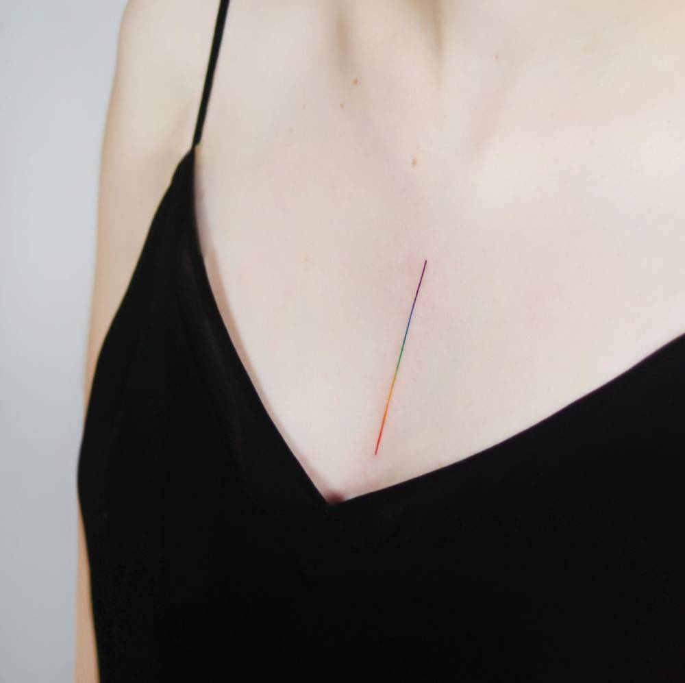 Visible spectrum line tattooed on the chest.