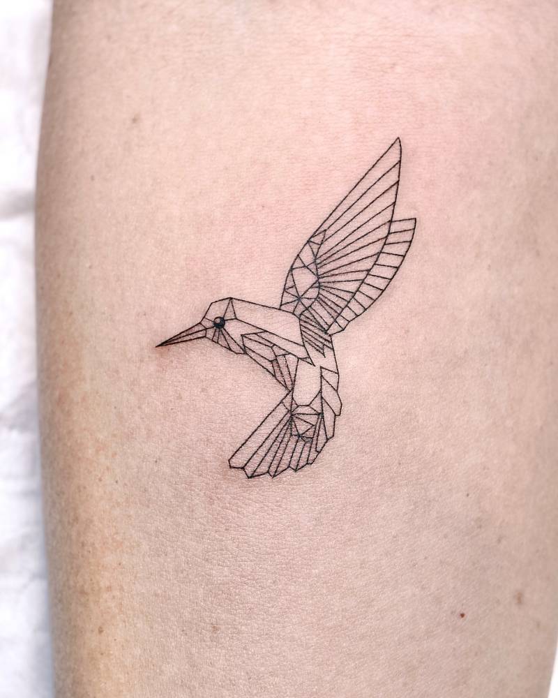 Low poly hummingbird tattoo located on the inner forearm.