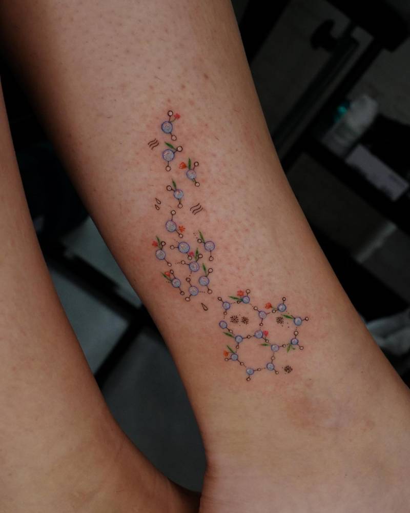 Chemical structure tattoo located on the ankle, illustrative style.