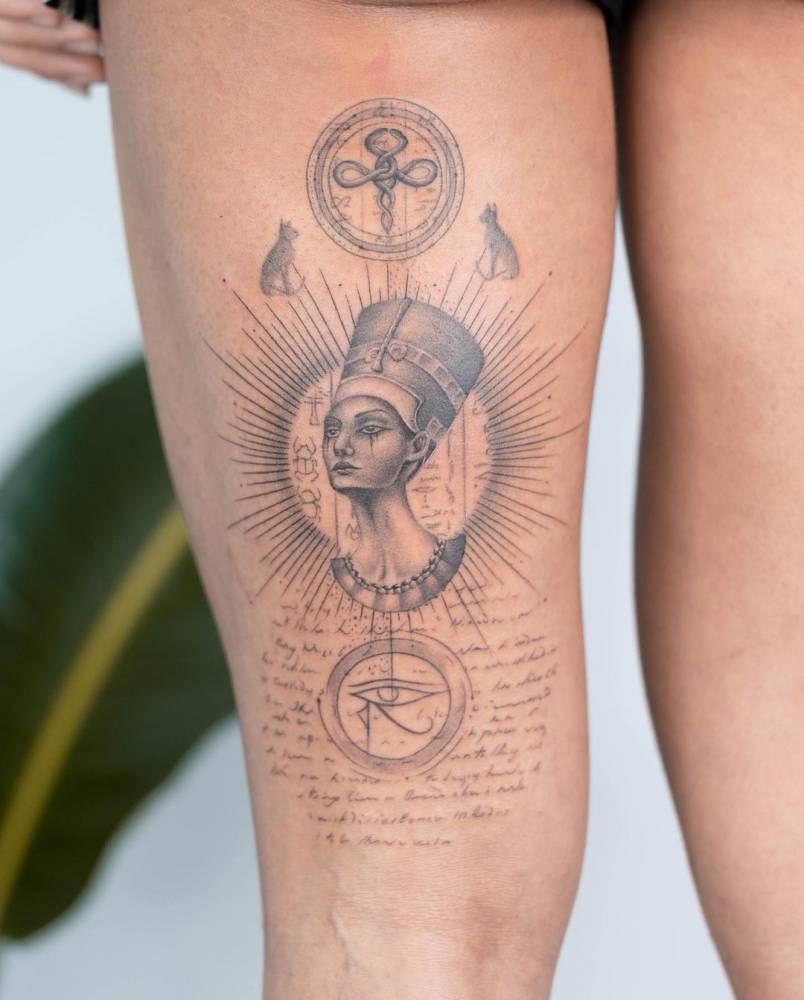 Micro-realistic Nefertiti tattoo on the thigh.