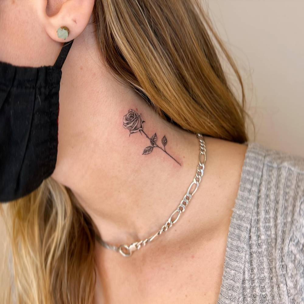 Micro-realistic rose tattoo done on the neck.