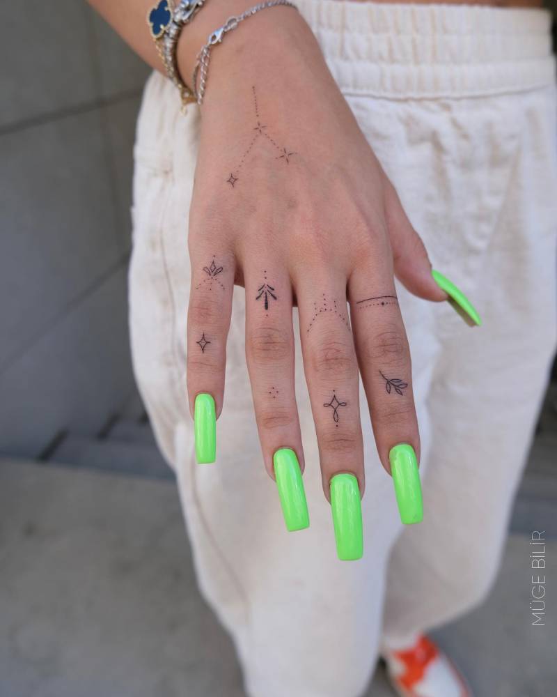 Fine line style hand composition tattoos.