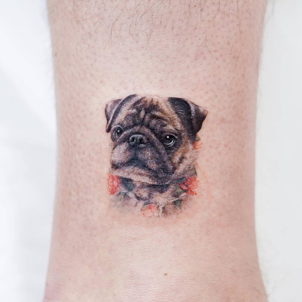 Pug portrait tattoo located on the ankle, watercolor style.