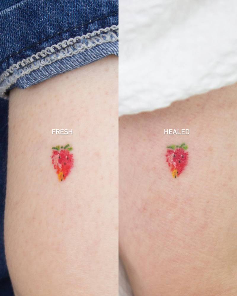 Fresh and healed strawberry tattoo located on the tricep.