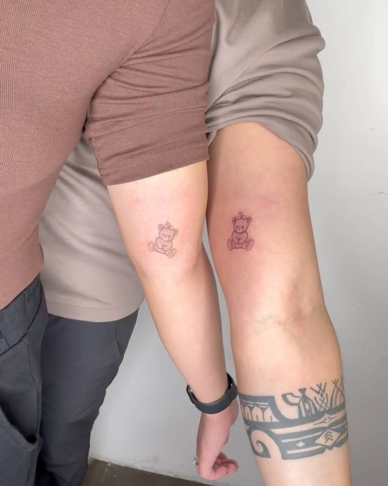 Matching teddy bear tattoo for couple.