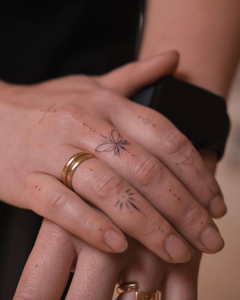 Finger composition tattoos hand poked style.