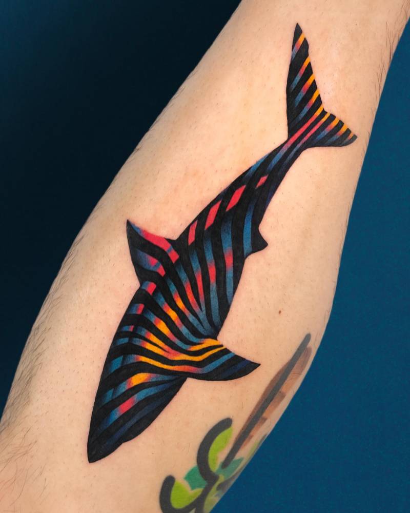 Pop art style shark tattoo located on the shin.