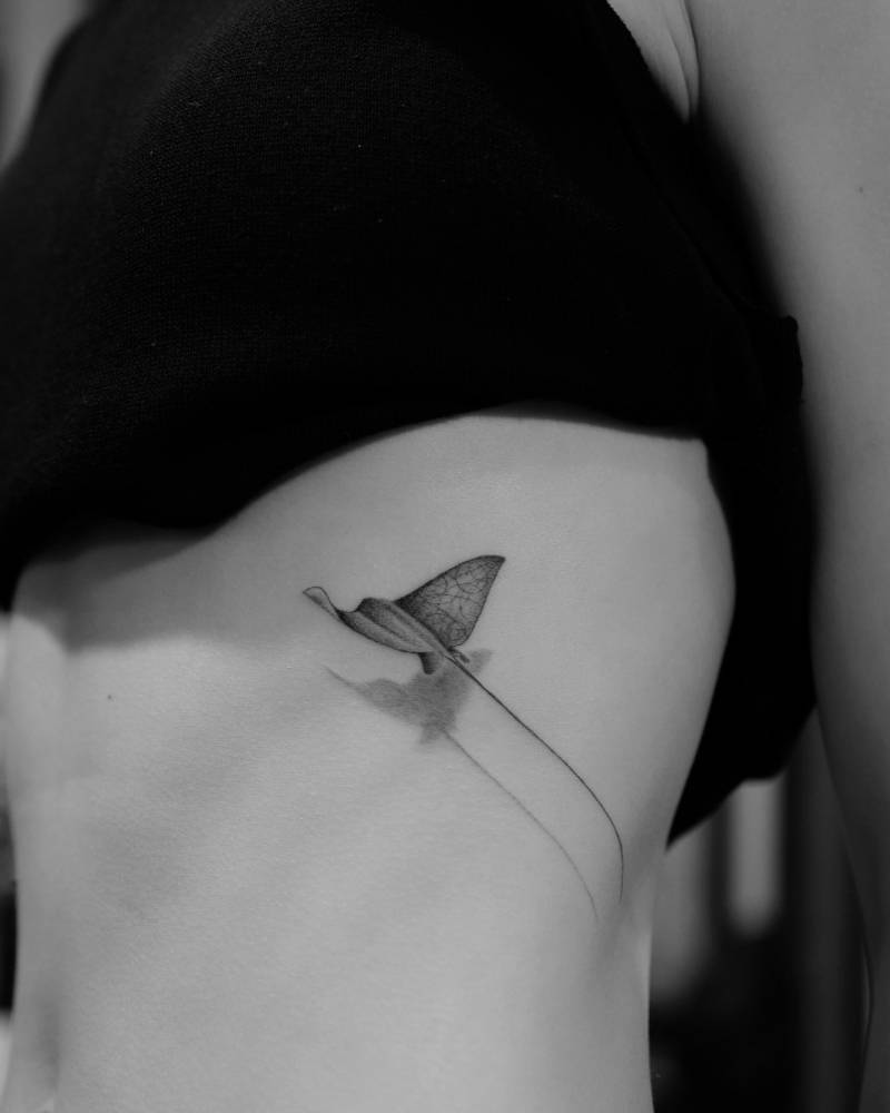 Micro-realistic style stingray tattoo located on the rib.