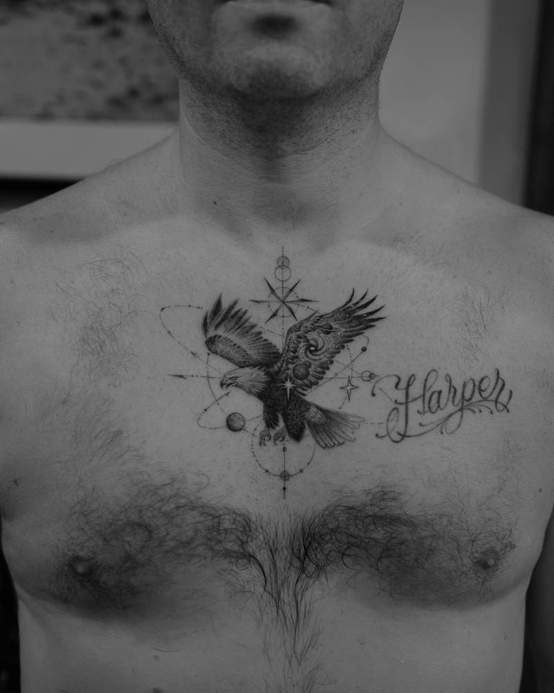Cosmic eagle tattoo located on the chest.