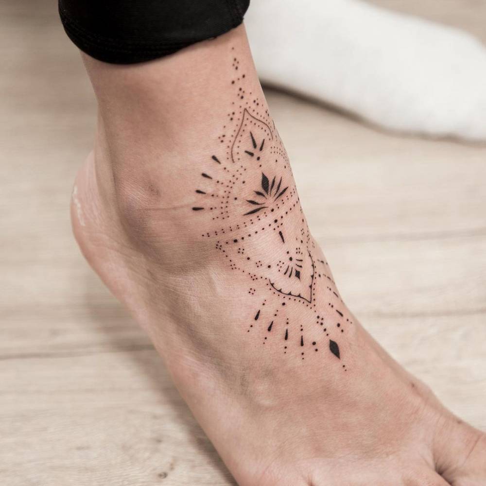 Ornamental tattoo on the ankle.