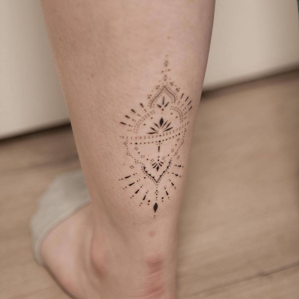 Ornamental tattoo on the achilles.