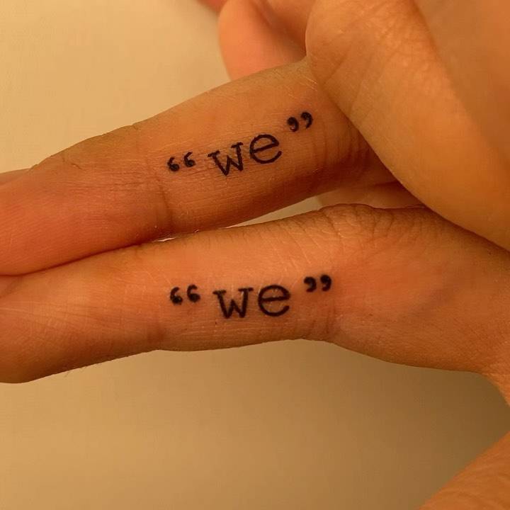 Matching "we" lettering tattoo for couple.