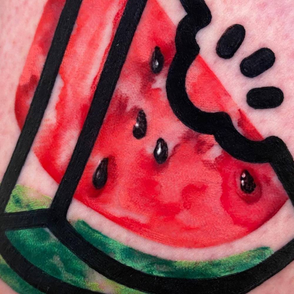 Pop art watermelon tattoo on the thigh.