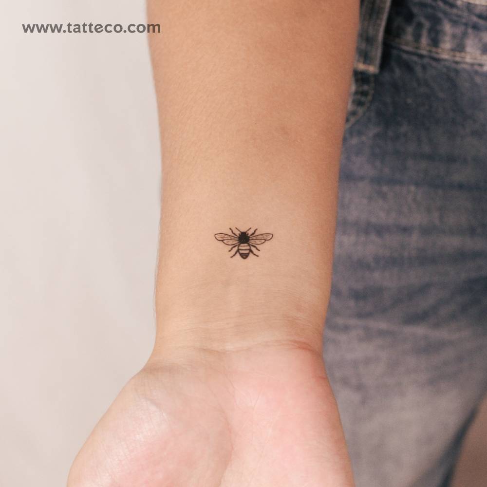 Bee 2-week temporary tattoo in illustrative style located on the wrist.