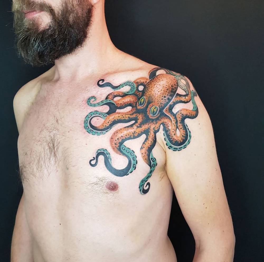 Octopus tattoo located on the shoulder and chest.