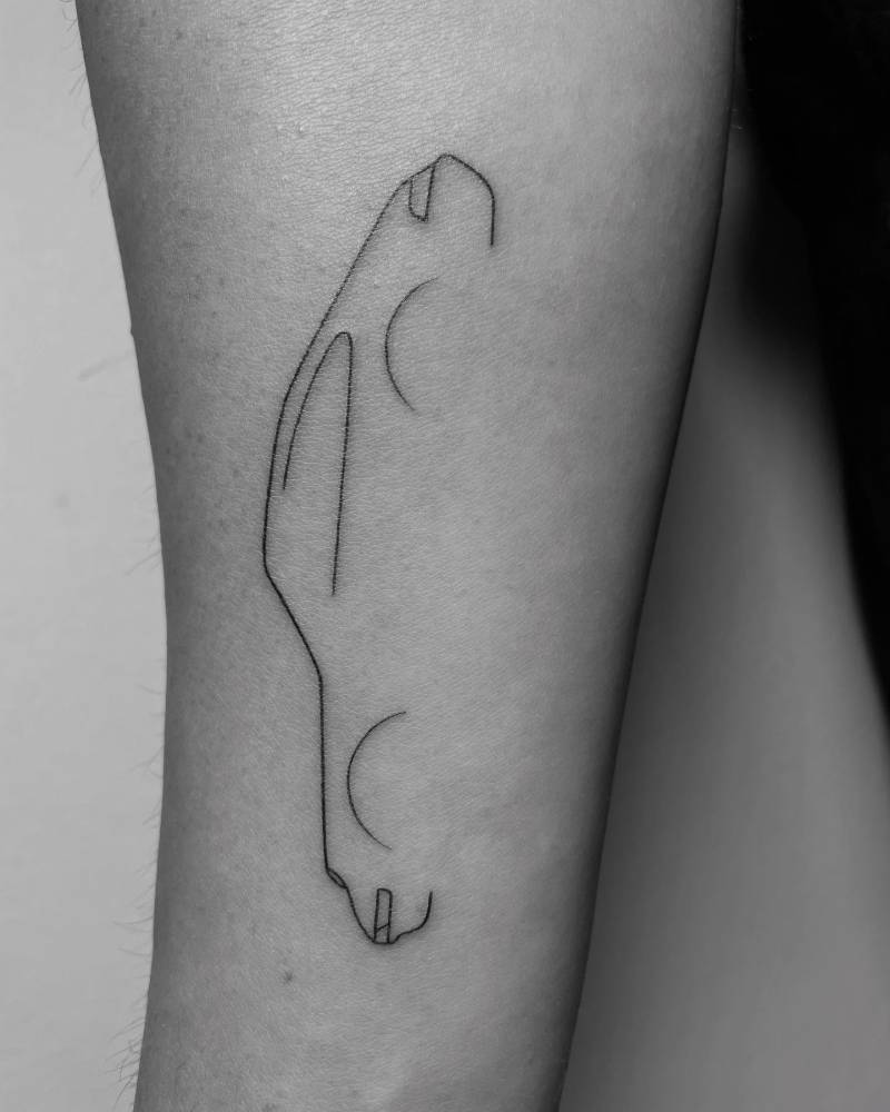 Minimalistic fine line Porsche 911 tattoo located on the inner forearm.