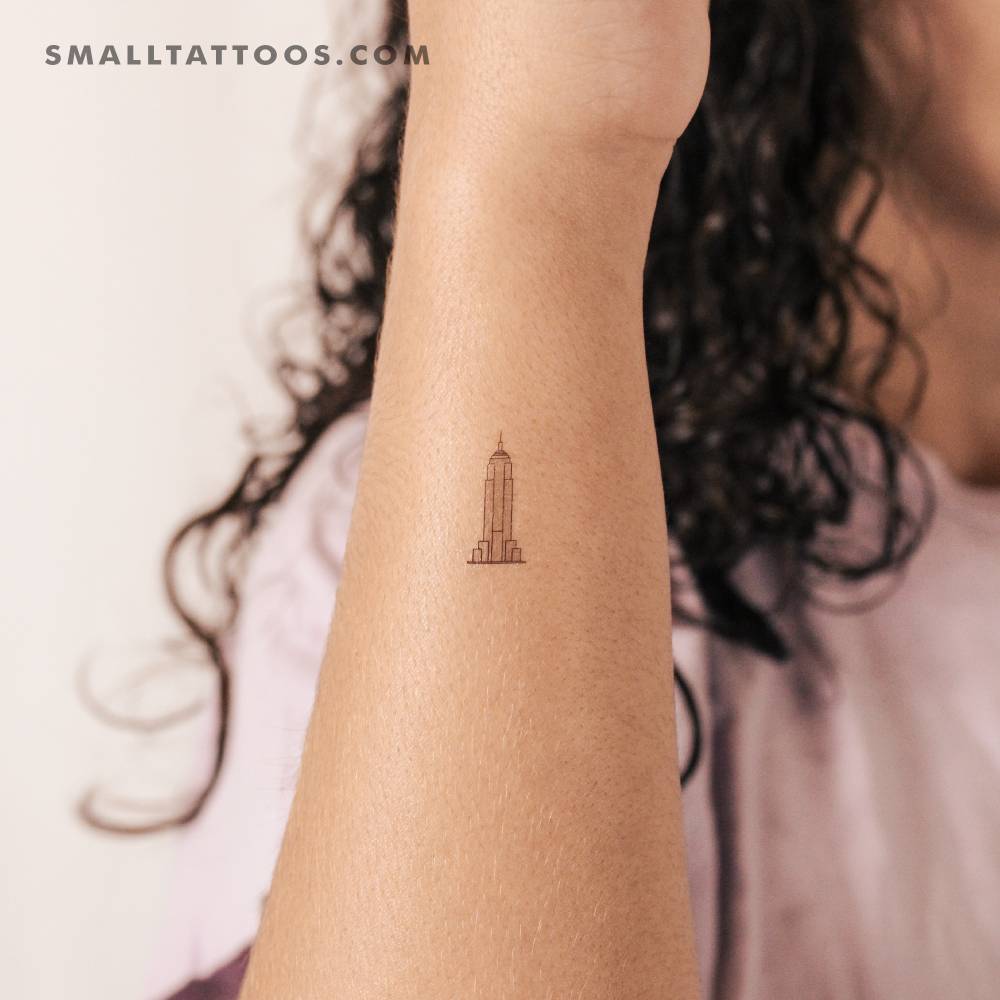 Tiny Empire State Building temporary tattoo located on the wrist.