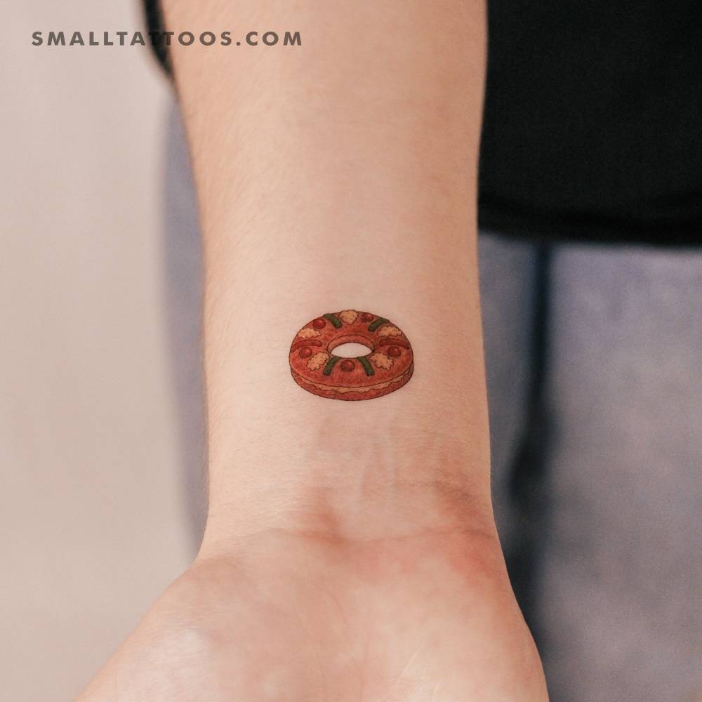 Spanish king cake temporary tattoo located on the wrist.