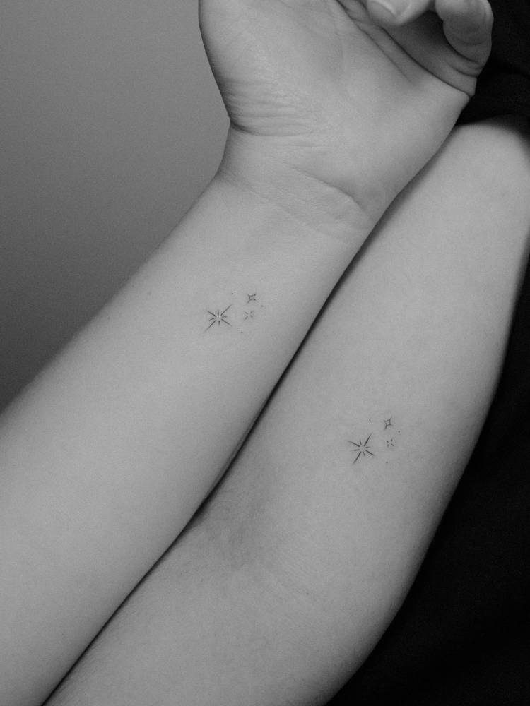 Matching sparkling stars tattoo for best friends, minimalistic style.