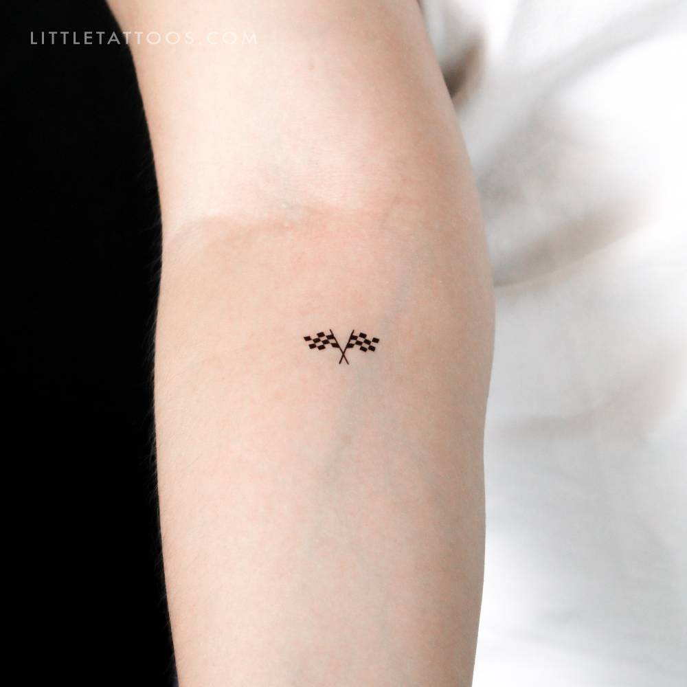 Double checkered flag temporary tattoo located on the inner forearm.