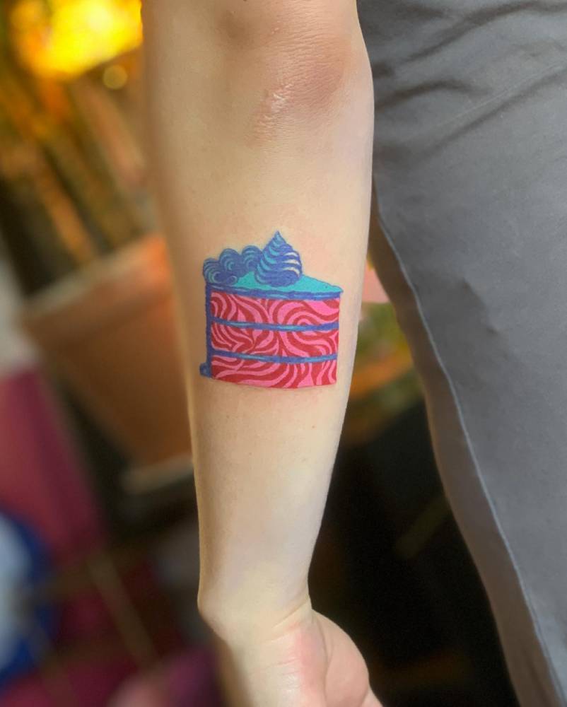 Cake tattoo done on the forearm.