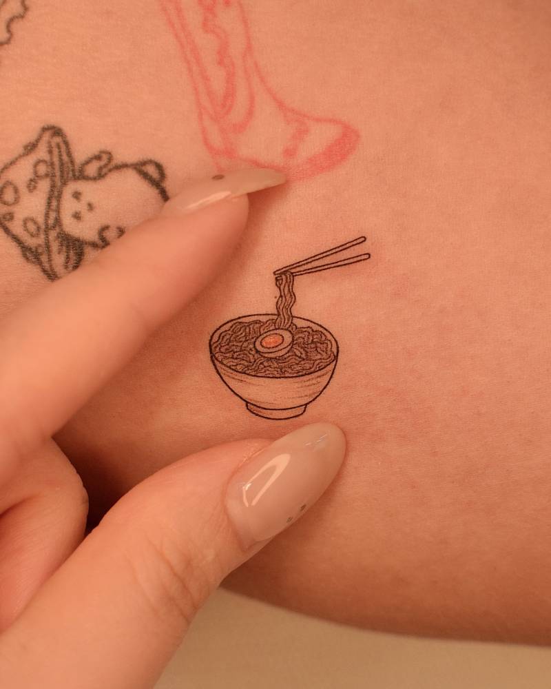 Illustrative style ramen tattoo located on the inner arm.