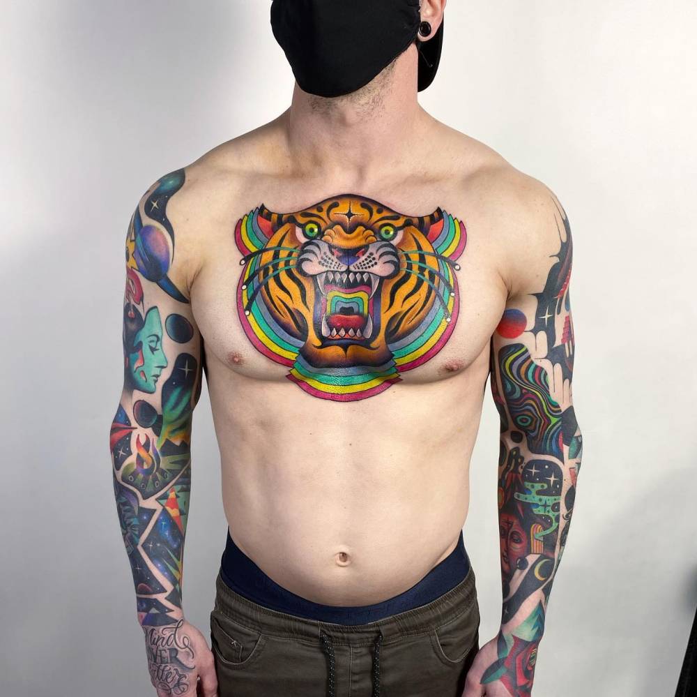 Tiger portrait tattoo located on the chest, neo japanese style.