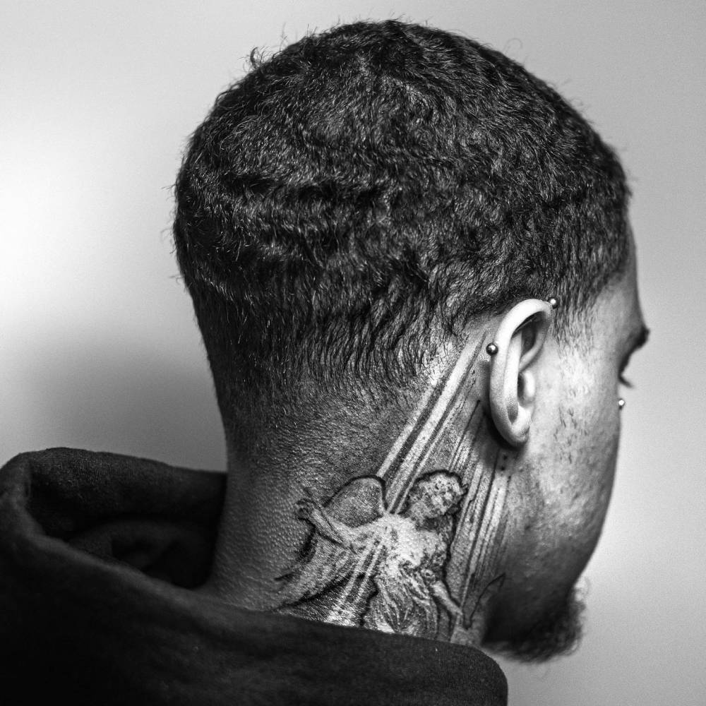 Angel tattoo located on the neck.