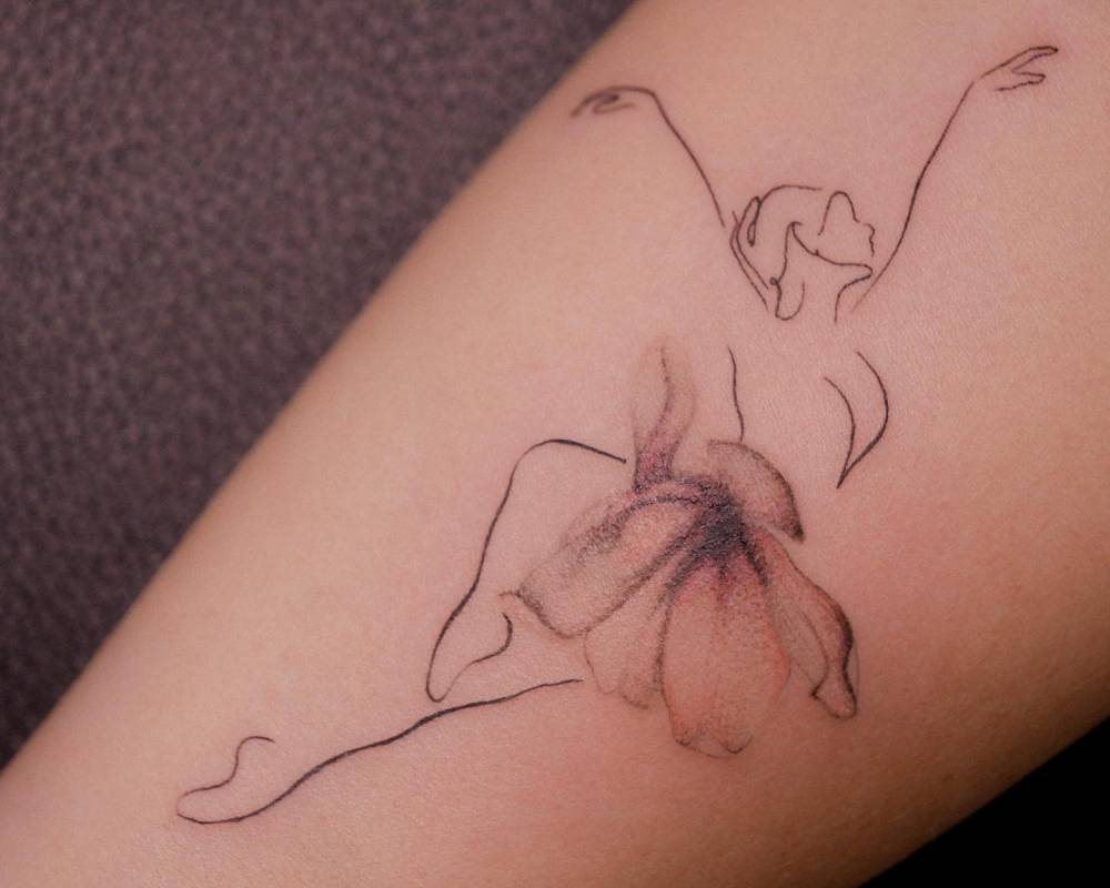Ballerina tattoo located on the inner forearm.