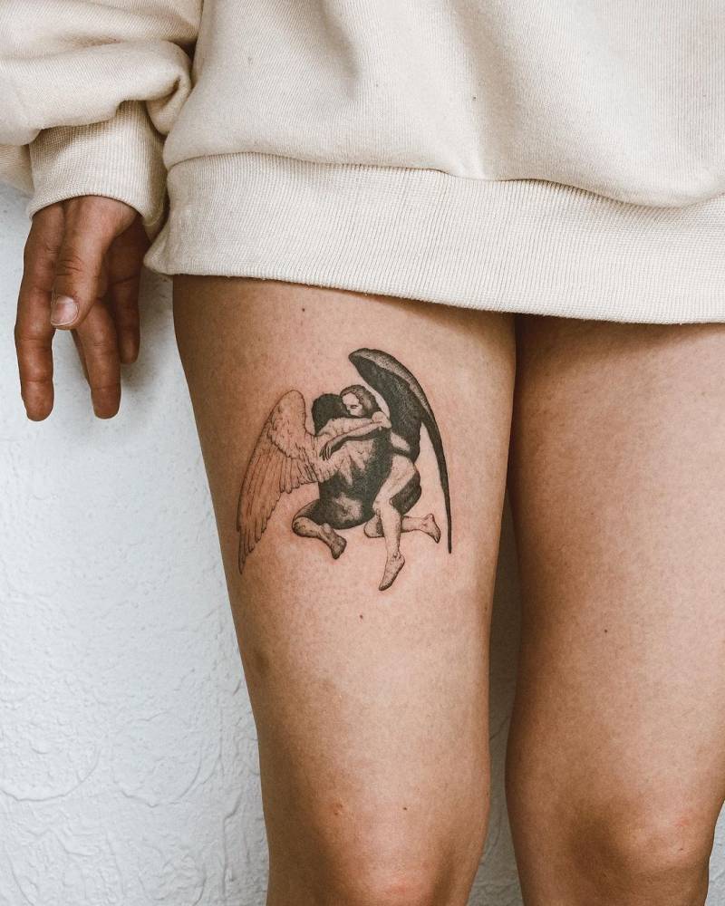 Roberto Ferri's artwork tattoo on the thigh.