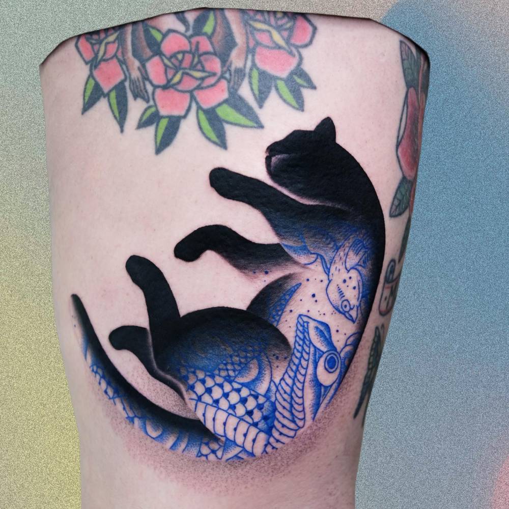 Tattooed Cat done on the thigh.