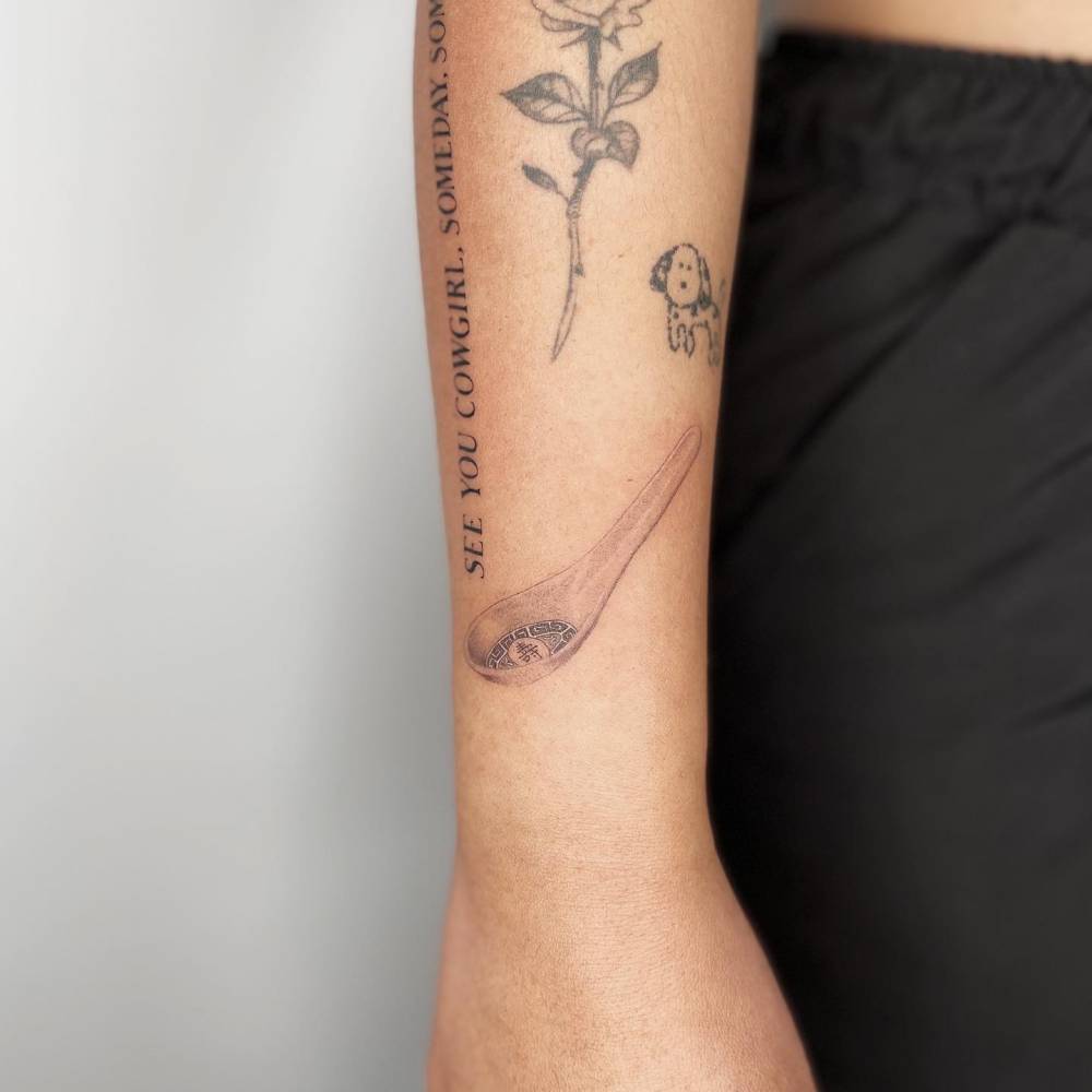 Spoon tattoo located on the forearm.