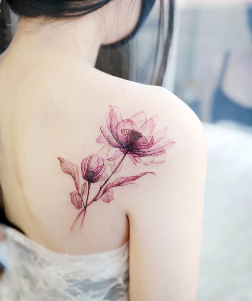 X-ray Lotus  tattoo located on the shoulder blade.