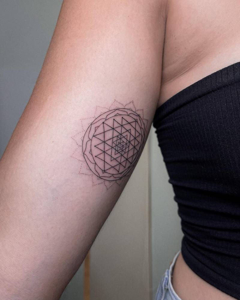 Sri Yantra tattoo located on the inner arm.