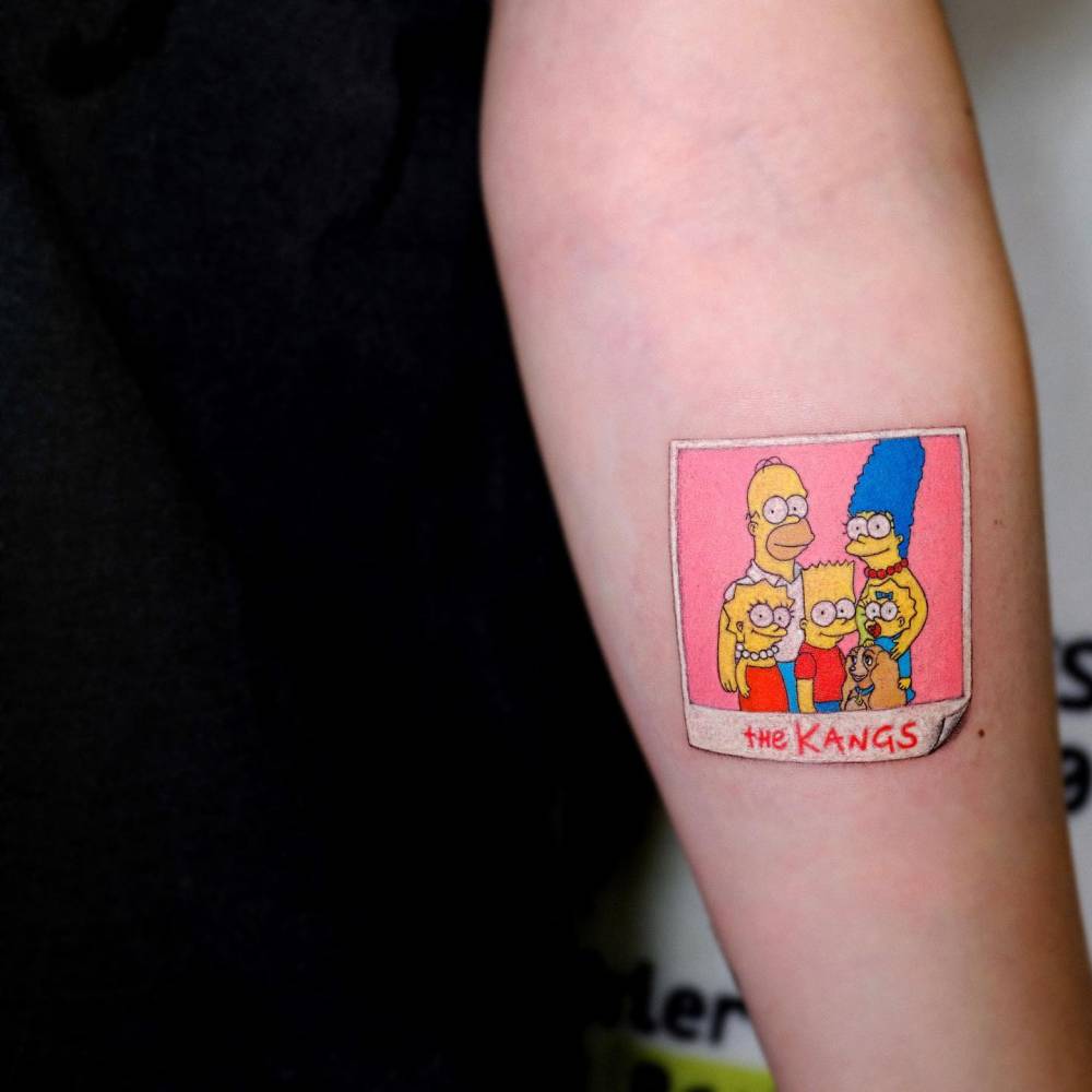 The Simpsons tattoo located on the inner forearm.