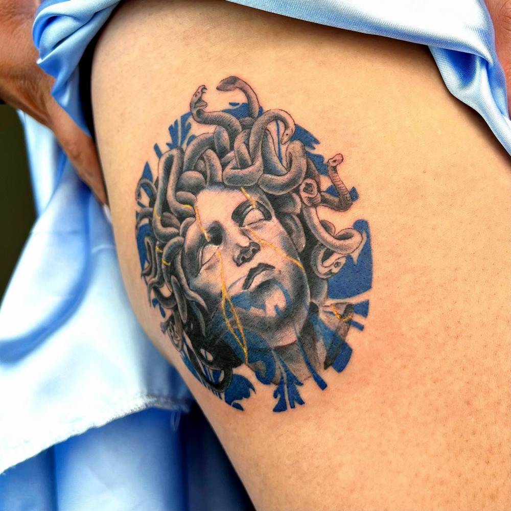 Porcelain Medusa portrait tattoo located on the hip.