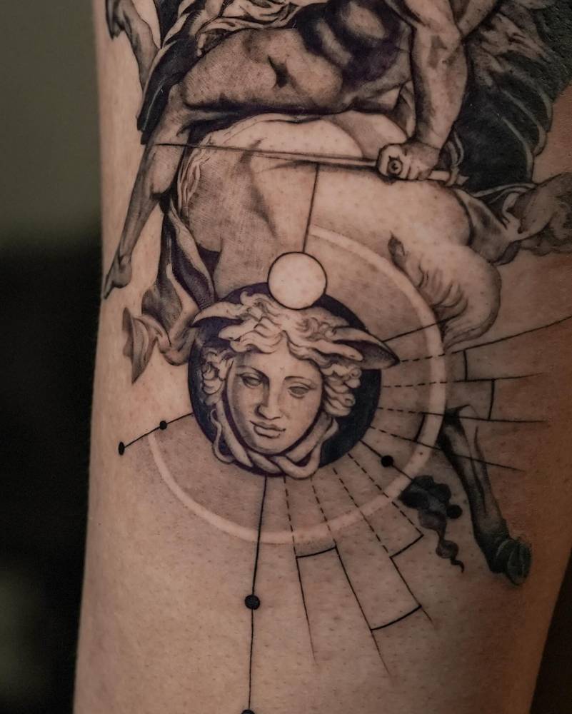 Medusa Ronadanini tattoo located on the upper arm.