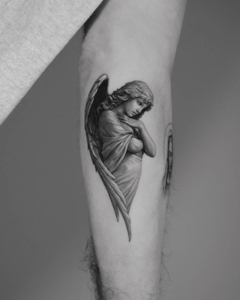 Angel tattoo in micro-realism located on the inner forearm.