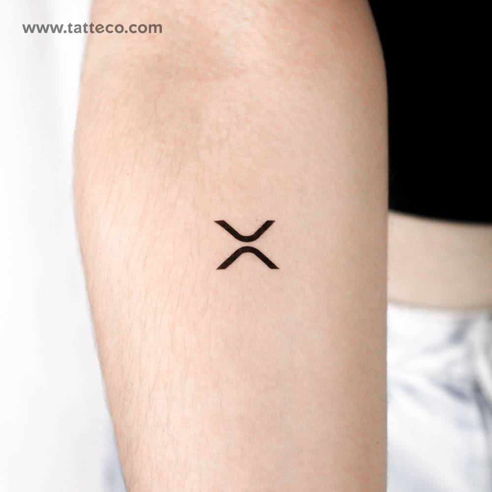 XRP logo temporary tattoo located on the inner forearm.
