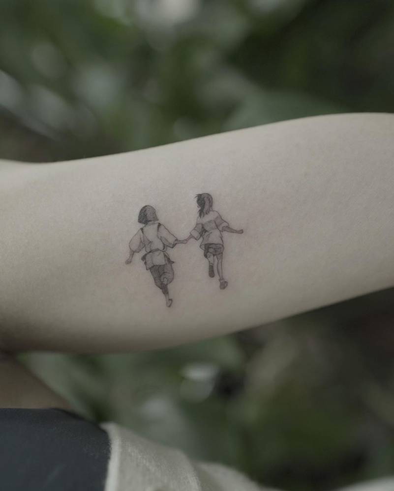 Spirited away tattoo done on the inner arm, cartoon style.