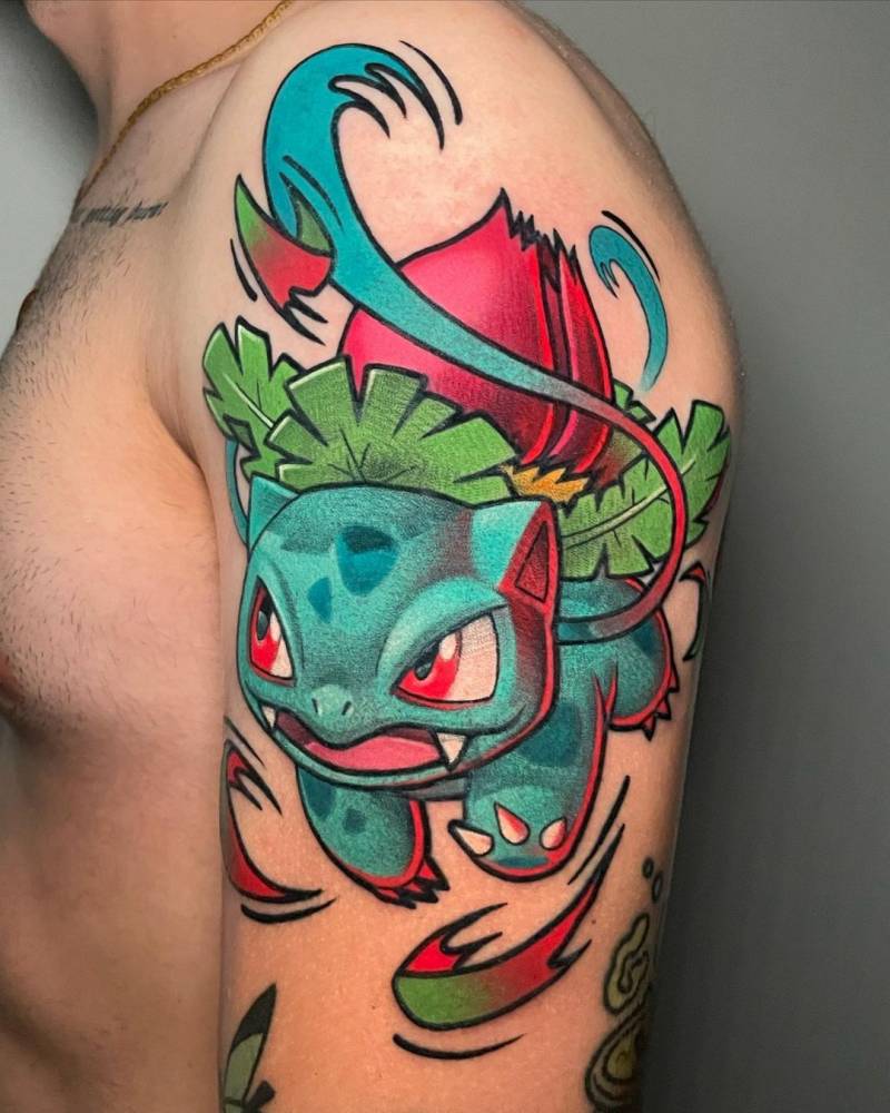 Large Ivysaur pokemon tattoo located on the upper arm.