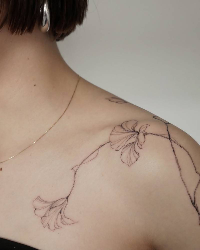Nasturtium tattoo in illustrative style located on the shoulder.