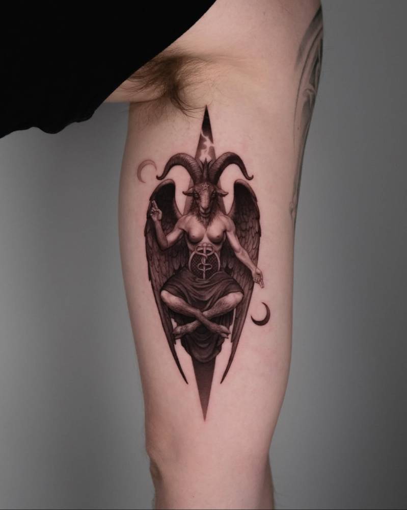 Micro-realistic style Baphomet tattoo located on the inner arm.