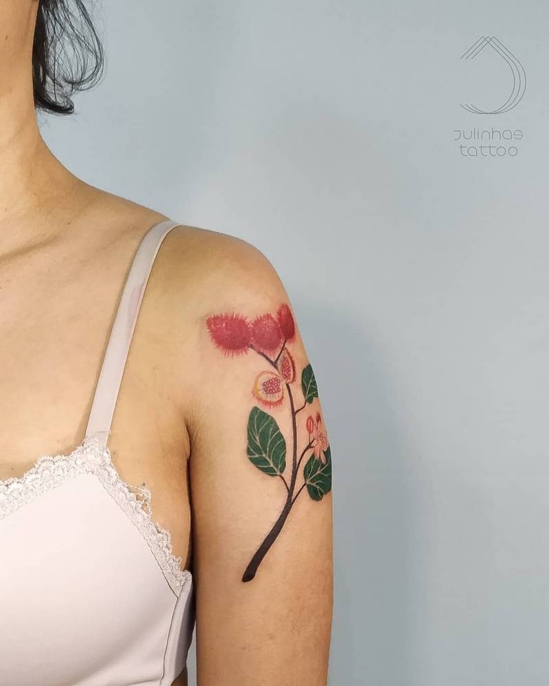 Achiote tattoo located on the upper arm.